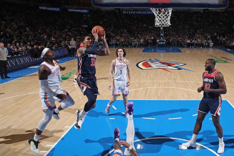 OKLAHOMA CITY, OK - FEBRUARY 23: Johnny Davis #1 of the Washington Wizards drives to the basket during the game against the Oklahoma City Thunder on February 23, 2024 at Paycom Arena in Oklahoma City, Oklahoma. NOTE TO USER: User expressly acknowledges and agrees that, by downloading and or using this photograph, User is consenting to the terms and conditions of the Getty Images License Agreement. Mandatory Copyright Notice: Copyright 2024 NBAE (Photo by Zach Beeker/NBAE via Getty Images)