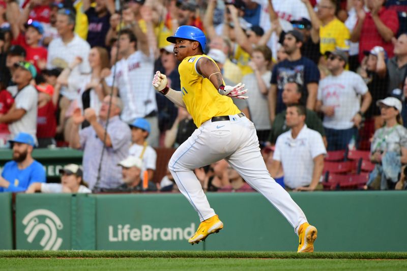 Aug 10, 2024; Boston, Massachusetts, USA;  Boston Red Sox third baseman Rafael Devers (11) hits a lead off double during the ninth inning against the Houston Astros at Fenway Park. Mandatory Credit: Bob DeChiara-USA TODAY Sports