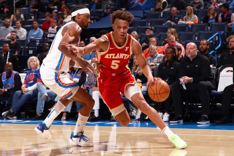 OKLAHOMA CITY, OK - OCTOBER 17: Luguentz Dort #5 of the Oklahoma City Thunder drives to the basket during the game against the Oklahoma City Thunder on October 17, 2024 at Paycom Arena in Oklahoma City, Oklahoma. NOTE TO USER: User expressly acknowledges and agrees that, by downloading and or using this photograph, User is consenting to the terms and conditions of the Getty Images License Agreement. Mandatory Copyright Notice: Copyright 2024 NBAE (Photo by Zach Beeker/NBAE via Getty Images)