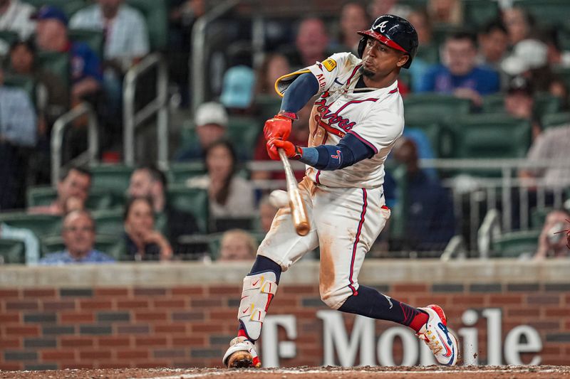 May 14, 2024; Cumberland, Georgia, USA; Atlanta Braves second baseman Ozzie Albies (1) singles against the Chicago Cubs during the sixth inning at Truist Park. Mandatory Credit: Dale Zanine-USA TODAY Sports