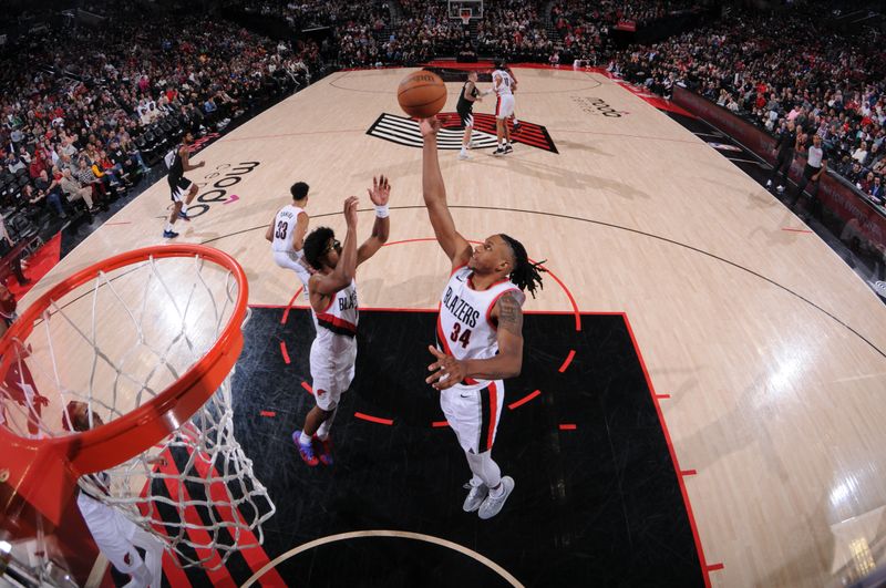 PORTLAND, OR - MARCH 22:  Jabari Walker #34 of the Portland Trail Blazers grabs the rebound during the game on March 22, 2024 at the Moda Center Arena in Portland, Oregon. NOTE TO USER: User expressly acknowledges and agrees that, by downloading and or using this photograph, user is consenting to the terms and conditions of the Getty Images License Agreement. Mandatory Copyright Notice: Copyright 2024 NBAE (Photo by Cameron Browne/NBAE via Getty Images)