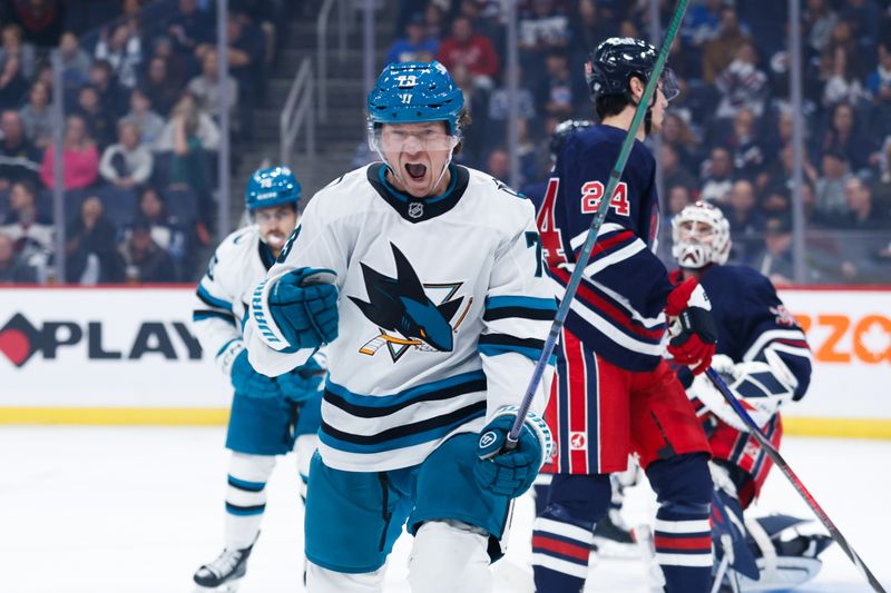 Oct 18, 2024; Winnipeg, Manitoba, CAN;  San Jose Sharks forward Tyler Toffoli (73) celebrates his goal against the Winnipeg Jets during the first period at Canada Life Centre. Mandatory Credit: Terrence Lee-Imagn Images