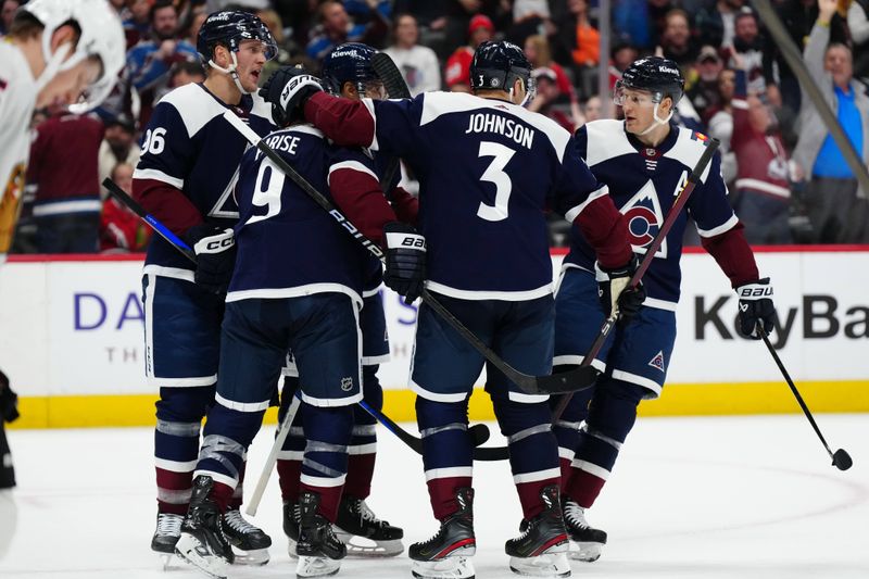 Mar 4, 2024; Denver, Colorado, USA; Colorado Avalanche left wing Zach Parise (9) celebrates his goal scored with right wing Mikko Rantanen (96) and defenseman Jack Johnson (3) and  center Nathan MacKinnon (29) in the second period against the Chicago Blackhawks at Ball Arena. Mandatory Credit: Ron Chenoy-USA TODAY Sports