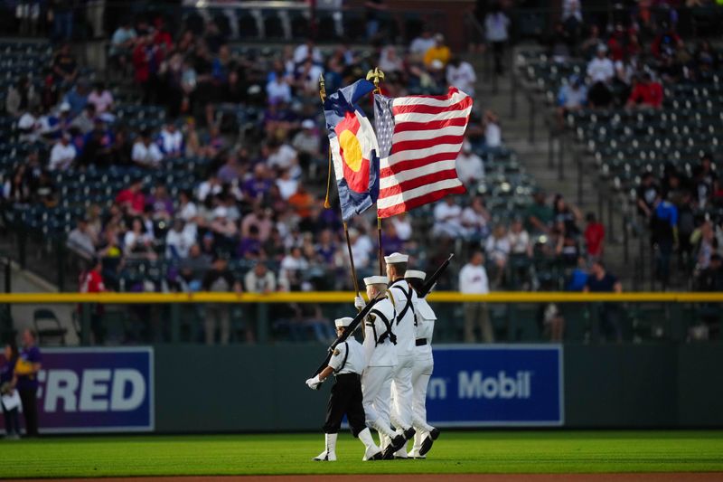 May 27, 2023; Denver, Colorado, USA; A Color Guard of United Naval Sea Cadet Corps display the colors before a game between the New York Mets against the Colorado Rockies Coors Field. Mandatory Credit: Ron Chenoy-USA TODAY Sports