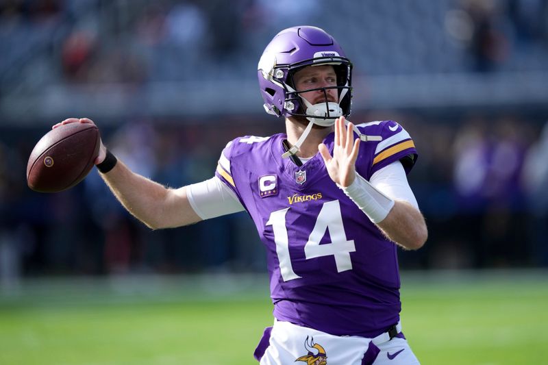 Minnesota Vikings quarterback Sam Darnold warms up before an NFL football game against the Chicago Bears, Sunday, Nov. 24, 2024, in Chicago. (AP Photo/Charles Rex Arbogast)