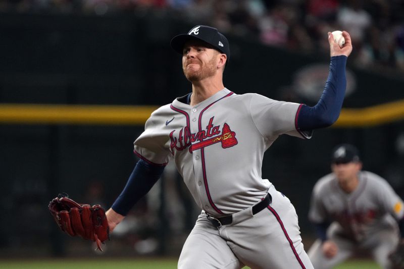 Apr 27, 2025; Phoenix, Arizona, USA; Atlanta Braves pitcher Aaron Bummer (49) throws against the Arizona Diamondbacks in the seventh inning at Chase Field. Mandatory Credit: Rick Scuteri-Imagn Images