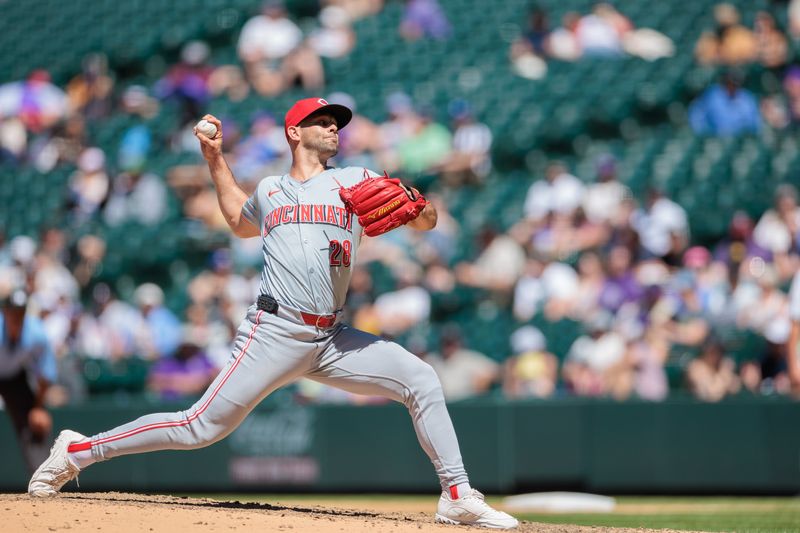 Jun 5, 2024; Denver, Colorado, USA; Cincinnati Reds relief pitcher Nick Martinez (28) delivers a pitch during the seventh inning against the Colorado Rockies at Coors Field. Mandatory Credit: Andrew Wevers-USA TODAY Sports