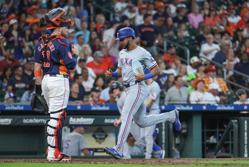 Apr 14, 2024; Houston, Texas, USA; Texas Rangers center fielder Leody Taveras (3) scores a run past Houston Astros catcher Victor Caratini (17) during the fifth inning at Minute Maid Park. Mandatory Credit: Troy Taormina-USA TODAY Sports