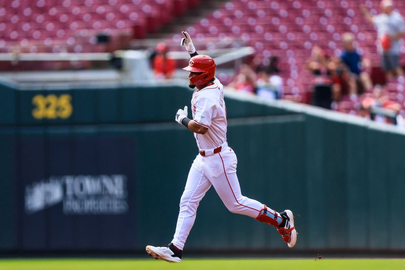 Aug 30, 2024; Cincinnati, Ohio, USA; Cincinnati Reds third baseman Santiago Espinal (4) runs the bases after hitting a solo home run in the second inning against the Milwaukee Brewers at Great American Ball Park. Mandatory Credit: Katie Stratman-USA TODAY Sports