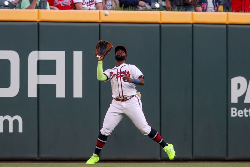 May 5, 2025; Atlanta, Georgia, USA; Atlanta Braves center fielder Michael Harris II (23) catches a fly ball against the Cincinnati Reds in the second inning at Truist Park. Mandatory Credit: Brett Davis-Imagn Images