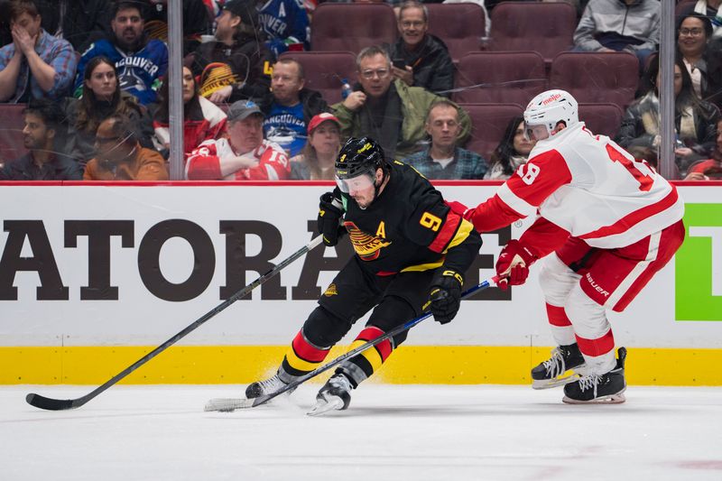 Feb 13, 2023; Vancouver, British Columbia, CAN; Detroit Red Wings forward Andrew Copp (18) stick checks Vancouver Canucks forward J.T. Miller (9) in the third period at Rogers Arena. Red Wings won 6-1. Mandatory Credit: Bob Frid-USA TODAY Sports