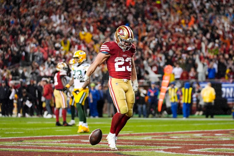 San Francisco 49ers running back Christian McCaffrey (23) runs to the end zone for a touchdown during an NFL football game against the Green Bay Packers Sunday, Jan. 21, 2024, in Santa Clara, Calif. (AP Photo/Ashley Landis)