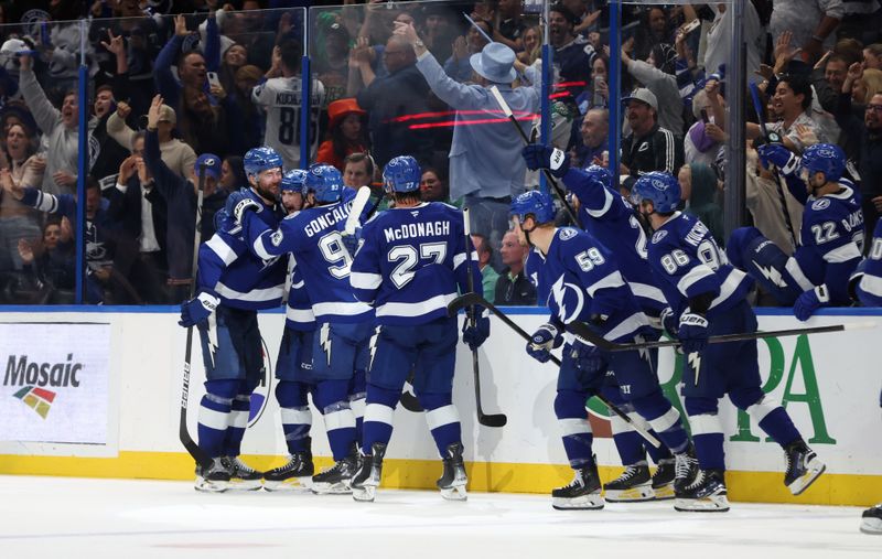 Oct 30, 2025; Tampa, Florida, USA; Tampa Bay Lightning center Anthony Cirelli (71) celebartes with teammates after he makes the game winning goal against the Dallas Stars during overtime at Benchmark International Arena. Mandatory Credit: Kim Klement Neitzel-Imagn Images