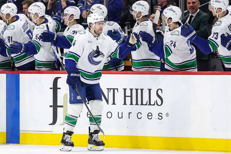 Dec 3, 2024; Saint Paul, Minnesota, USA; Vancouver Canucks left wing Jake DeBrusk (74) celebrates his goal with teammates against the Minnesota Wild during the second period at Xcel Energy Center. Mandatory Credit: Matt Krohn-Imagn Images