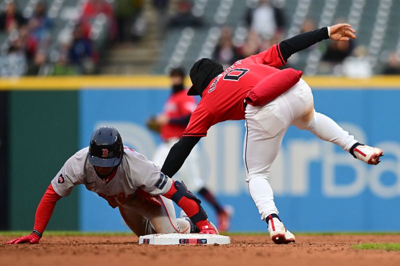 Apr 24, 2024; Cleveland, Ohio, USA; Boston Red Sox shortstop Ceddanne Rafaela (43) is safe at second under the tag of Cleveland Guardians second baseman Andres Gimenez (0) during the sixth inning at Progressive Field. Mandatory Credit: Ken Blaze-USA TODAY Sports