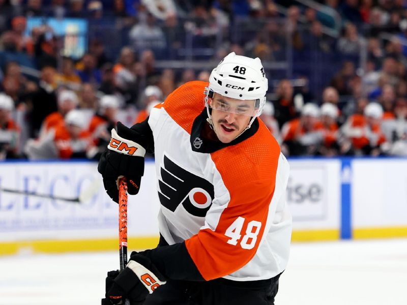 Nov 3, 2023; Buffalo, New York, USA;  Philadelphia Flyers center Morgan Frost (48) takes a shot on goal during the first period against the Buffalo Sabres at KeyBank Center. Mandatory Credit: Timothy T. Ludwig-USA TODAY Sports