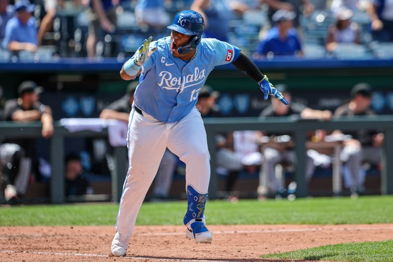Jun 26, 2024; Kansas City, Missouri, USA; Kansas City Royals catcher Salvador Perez (13) reacts after hitting a two RBI double against the Miami Marlins during the eighth inning at Kauffman Stadium. Mandatory Credit: William Purnell-USA TODAY Sports