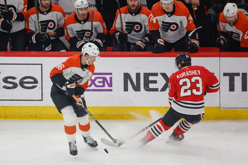 Feb 21, 2024; Chicago, Illinois, USA; Chicago Blackhawks center Philipp Kurashev (23) defends against Philadelphia Flyers left wing Joel Farabee (86) during the first period at United Center. Mandatory Credit: Kamil Krzaczynski-USA TODAY Sports