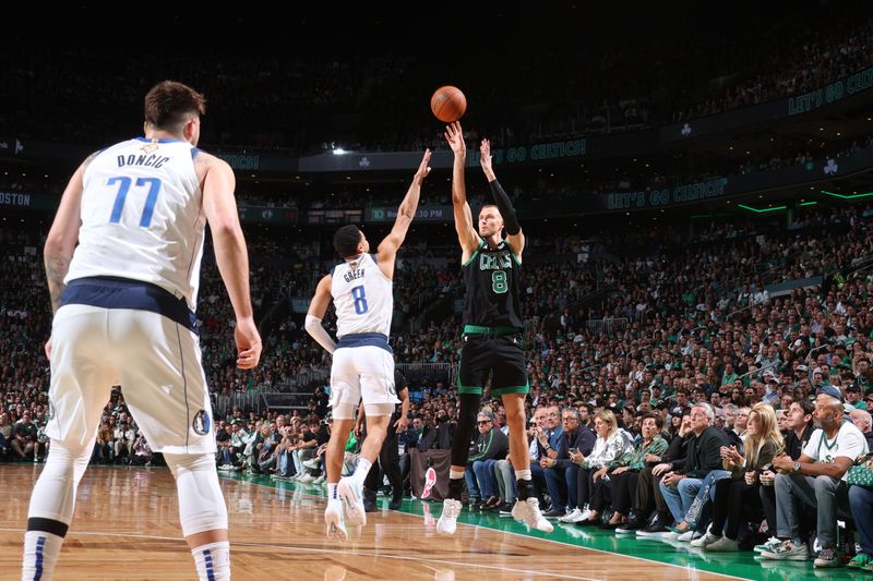 BOSTON, MA - JUNE 9: Kristaps Porzingis #8 of the Boston Celtics shoots a three point basket during the game  against the Dallas Mavericks during Game 1 of the 2024 NBA Finals on June 9, 2024 at the TD Garden in Boston, Massachusetts. NOTE TO USER: User expressly acknowledges and agrees that, by downloading and or using this photograph, User is consenting to the terms and conditions of the Getty Images License Agreement. Mandatory Copyright Notice: Copyright 2024 NBAE  (Photo by Nathaniel S. Butler/NBAE via Getty Images)