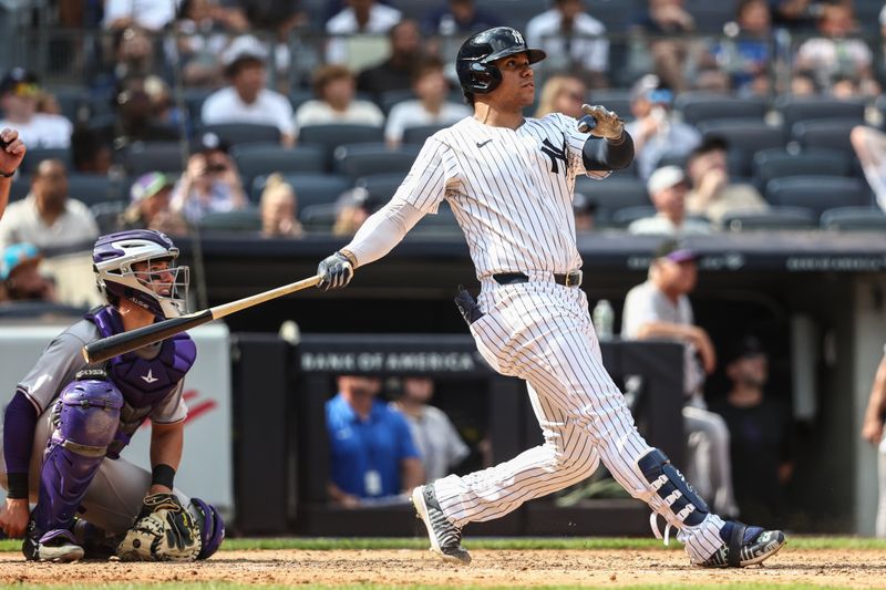 Aug 25, 2024; Bronx, New York, USA;  New York Yankees right fielder Juan Soto (22) hits a solo home run in the seventh inning against the Colorado Rockies at Yankee Stadium. Mandatory Credit: Wendell Cruz-USA TODAY Sports