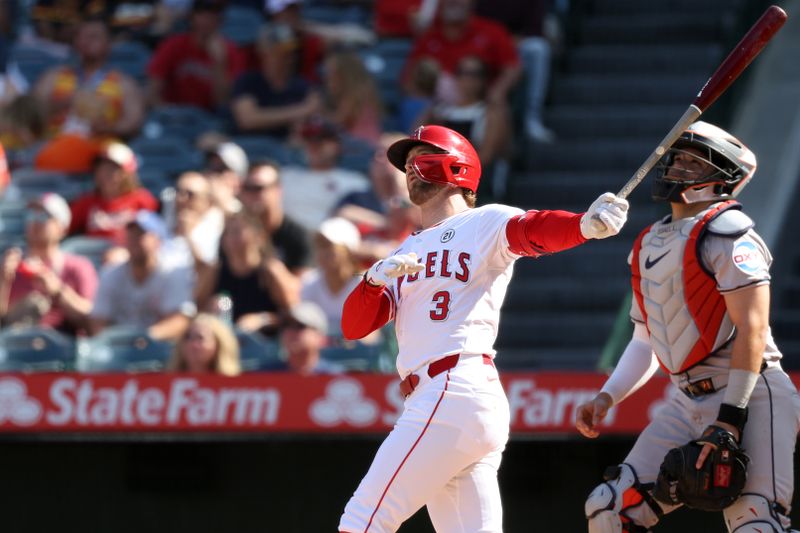 Sep 15, 2024; Anaheim, California, USA;  Los Angeles Angels left fielder Taylor Ward (3) hits a home run during the eighth inning against the Houston Astros at Angel Stadium. Mandatory Credit: Kiyoshi Mio-Imagn Images