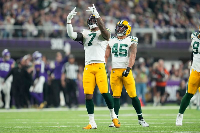 Green Bay Packers linebacker Quay Walker (7) celebrates after sacking Minnesota Vikings quarterback Jaren Hall (16) during the first half of an NFL football game Sunday, Dec. 31, 2023, in Minneapolis. (AP Photo/Abbie Parr)