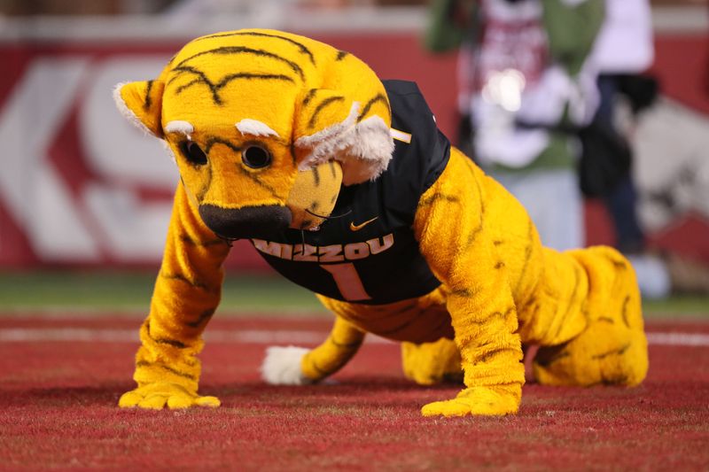 Nov 24, 2023; Fayetteville, Arkansas, USA; Missouri Tigers mascot does pushups after a score in the third quarter against the Arkansas Razorbacks at Donald W. Reynolds Razorback Stadium. Missouri won 48-14. Mandatory Credit: Nelson Chenault-USA TODAY Sports