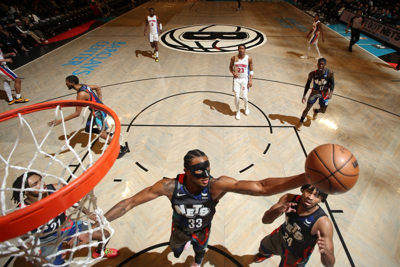 BROOKLYN, NY - APRIL 6: Nicolas Claxton #33 of the Brooklyn Nets grabs a rebound during the game against the Detroit Pistons on April 6, 2024 at Barclays Center in Brooklyn, New York. NOTE TO USER: User expressly acknowledges and agrees that, by downloading and or using this Photograph, user is consenting to the terms and conditions of the Getty Images License Agreement. Mandatory Copyright Notice: Copyright 2024 NBAE (Photo by Nathaniel S. Butler/NBAE via Getty Images)