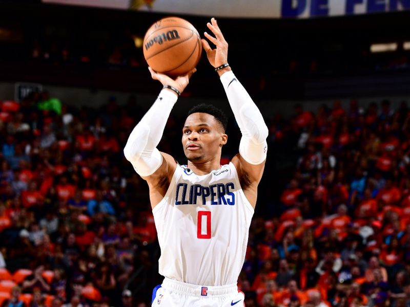 PHOENIX, AZ - APRIL 25: Russell Westbrook  #0 of the LA Clippers shoots a three point basket during the game against the Phoenix Suns during Round 1 Game 5 of the 2023 NBA Playoffs on April 25, 2023 at Footprint Center in Phoenix, Arizona. NOTE TO USER: User expressly acknowledges and agrees that, by downloading and or using this photograph, user is consenting to the terms and conditions of the Getty Images License Agreement. Mandatory Copyright Notice: Copyright 2023 NBAE (Photo by Barry Gossage/NBAE via Getty Images)