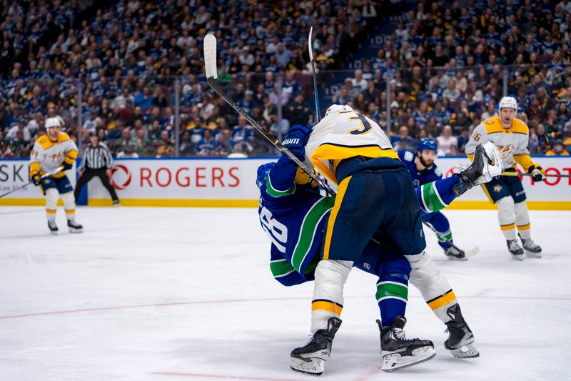 Apr 23, 2024; Vancouver, British Columbia, CAN; Nashville Predators defenseman Jeremy Lauzon (3) checks Vancouver Canucks forward Sam Lafferty (18) during the third period in game two of the first round of the 2024 Stanley Cup Playoffs at Rogers Arena. Mandatory Credit: Bob Frid-USA TODAY Sports