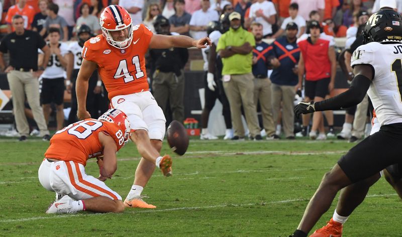 Oct 7, 2023; Clemson, South Carolina, USA; Clemson Tigers kicker Jonathan Weitz (41) makes an extra point against the Wake Forest Demon Deacons during the fourth quarter at Memorial Stadium. Mandatory Credit: Ken Ruinard-USA TODAY Sports