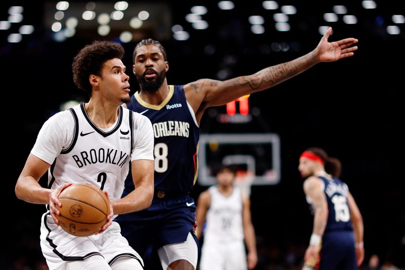 NEW YORK, NEW YORK - MARCH 19: Cameron Johnson #2 of the Brooklyn Nets looks to pass as Naji Marshall #8 of the New Orleans Pelicans defends during the second half at Barclays Center on March 19, 2024 in the Brooklyn borough of New York City. The Pelicans won 104-91. NOTE TO USER: User expressly acknowledges and agrees that, by downloading and/or using this Photograph, user is consenting to the terms and conditions of the Getty Images License Agreement. (Photo by Sarah Stier/Getty Images)