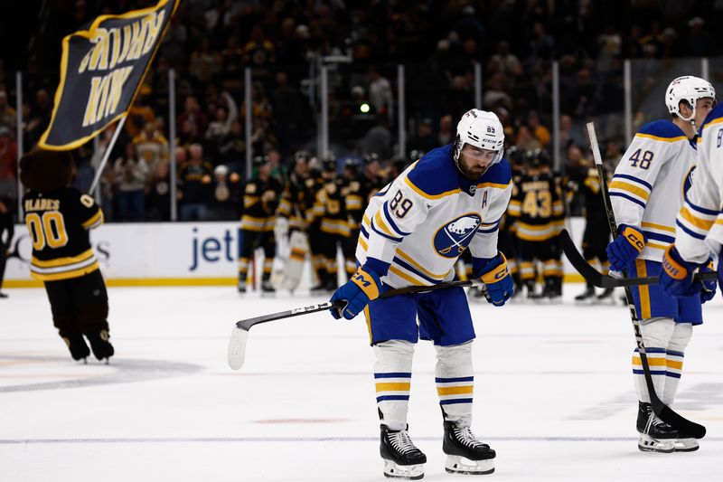 Oct 11, 2025; Boston, Massachusetts, USA; Buffalo Sabres right wing Alex Tuch (89) hangs his head as the Boston Bruins congratulate each other after Boston’s 3-1 win at TD Garden. Mandatory Credit: Winslow Townson-Imagn Images