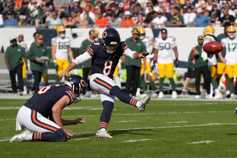 Chicago Bears place kicker Cairo Santos (8) kick a field goal off the hold of Trenton Gill during the first half of an NFL football game against the Green Bay Packers Sunday, Sept. 10, 2023, in Chicago. (AP Photo/Nam Y. Huh)