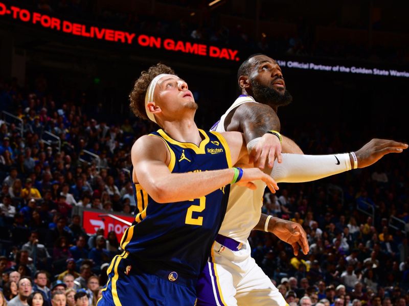 SAN FRANCISCO, CA - JANUARY 27:  Brandin Podziemski #2 of the Golden State Warriors and LeBron James #23 of the Los Angeles Lakers battle for position during the game against the Los Angeles Lakers on January 27, 2024 at Chase Center in San Francisco, California. NOTE TO USER: User expressly acknowledges and agrees that, by downloading and or using this photograph, user is consenting to the terms and conditions of Getty Images License Agreement. Mandatory Copyright Notice: Copyright 2024 NBAE (Photo by Barry Gossage/NBAE via Getty Images)