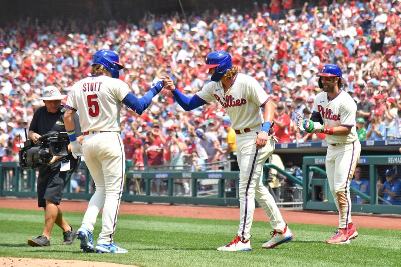 Aug 6, 2023; Philadelphia, Pennsylvania, USA; Philadelphia Phillies second baseman Bryson Stott (5) celebrates his home run with first baseman Alec Bohm (28), and designated hitter Bryce Harper (3) against the Kansas City Royals during the first inning at Citizens Bank Park. Mandatory Credit: Eric Hartline-USA TODAY Sports