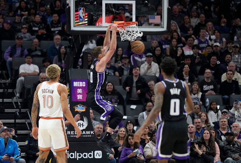 SACRAMENTO, CALIFORNIA - MARCH 07: Domantas Sabonis #10 of the Sacramento Kings slam dunks against the San Antonio Spurs during the first half at Golden 1 Center on March 07, 2024 in Sacramento, California. NOTE TO USER: User expressly acknowledges and agrees that, by downloading and or using this photograph, User is consenting to the terms and conditions of the Getty Images License Agreement. (Photo by Thearon W. Henderson/Getty Images)