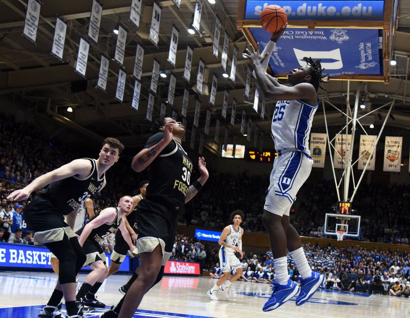 Feb 12, 2024; Durham, North Carolina, USA;  Duke Blue Devils forward Mark Mitchell (25) shoots over Wake Forest Deamon Deacons guard Damari Monsanto (30) during the second half at Cameron Indoor Stadium. The Blue Devils won 77-69. Mandatory Credit: Rob Kinnan-USA TODAY Sports