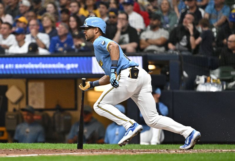 Jun 11, 2024; Milwaukee, Wisconsin, USA; Milwaukee Brewers outfielder Blake Perkins (16) gets a base hit against the Toronto Blue Jays in the sixth inning at American Family Field. Mandatory Credit: Michael McLoone-USA TODAY Sports