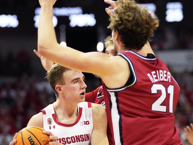 Feb 18, 2023; Madison, Wisconsin, USA;  Wisconsin Badgers forward Tyler Wahl (5) is double teamed by Rutgers Scarlet Knights forward Dean Reiber (21) and guard Cam Spencer (10) during the second half at the Kohl Center. Mandatory Credit: Kayla Wolf-USA TODAY Sports