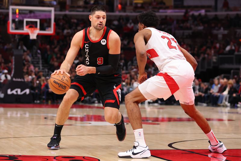 CHICAGO, ILLINOIS - JANUARY 30: Nikola Vucevic #9 of the Chicago Bulls drives to the basket against Thaddeus Young #21 of the Toronto Raptors during the first half at the United Center on January 30, 2024 in Chicago, Illinois. NOTE TO USER: User expressly acknowledges and agrees that, by downloading and or using this photograph, User is consenting to the terms and conditions of the Getty Images License Agreement.  (Photo by Michael Reaves/Getty Images)