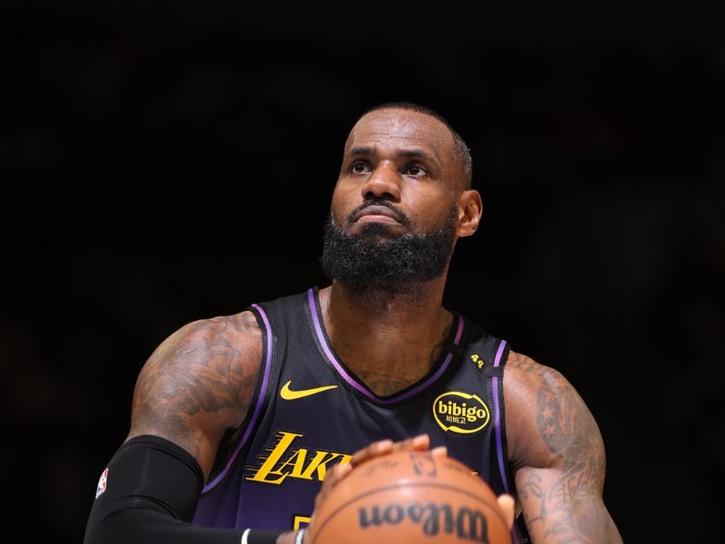 MINNEAPOLIS, MN -  DECEMBER 2: LeBron James #23 of the Los Angeles Lakers shoots a free throw during the game against the Minnesota Timberwolves on December 2, 2024 at Target Center in Minneapolis, Minnesota. NOTE TO USER: User expressly acknowledges and agrees that, by downloading and or using this Photograph, user is consenting to the terms and conditions of the Getty Images License Agreement. Mandatory Copyright Notice: Copyright 2024 NBAE (Photo by David Sherman/NBAE via Getty Images)