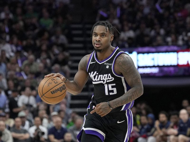 SACRAMENTO, CALIFORNIA - APRIL 11: Davion Mitchell #15 of the Sacramento Kings dribbles the ball against the New Orleans Pelicans during the second half of an NBA basketball game at Golden 1 Center on April 11, 2024 in Sacramento, California. NOTE TO USER: User expressly acknowledges and agrees that, by downloading and or using this photograph, User is consenting to the terms and conditions of the Getty Images License Agreement. (Photo by Thearon W. Henderson/Getty Images)