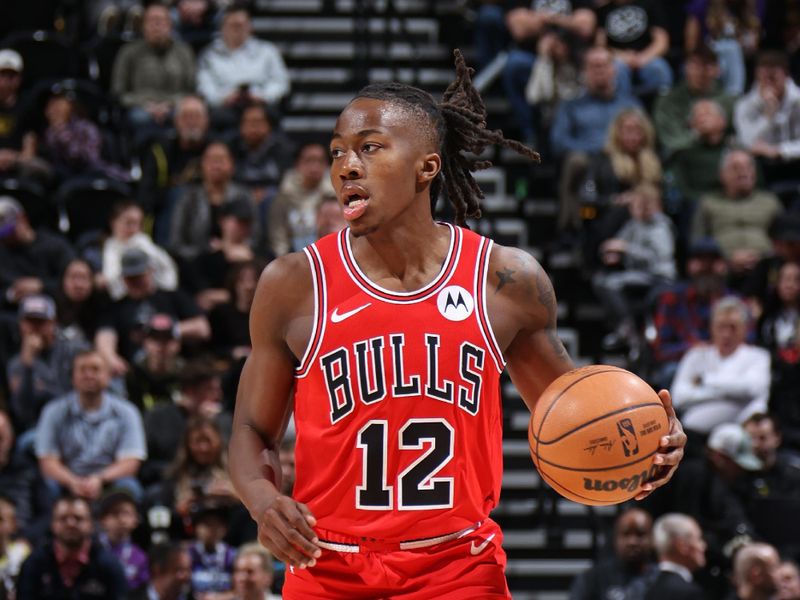 SALT LAKE CITY, UT - MARCH 6:  Ayo Dosunmu #12 of the Chicago Bulls dribbles the ball during the game against the Utah Jazz on March 6, 2024 at Delta Center in Salt Lake City, Utah. NOTE TO USER: User expressly acknowledges and agrees that, by downloading and or using this Photograph, User is consenting to the terms and conditions of the Getty Images License Agreement. Mandatory Copyright Notice: Copyright 2024 NBAE (Photo by Melissa Majchrzak/NBAE via Getty Images)