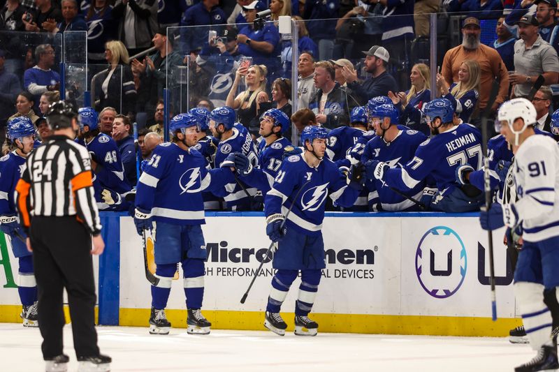 Feb 25, 2026; Tampa, Florida, USA; Tampa Bay Lightning forward Brayden Point (21) celebrates with the bench after a goal against the Toronto Maple Leafs during the second period at Benchmark International Arena. Mandatory Credit: Morgan Tencza-Imagn Images