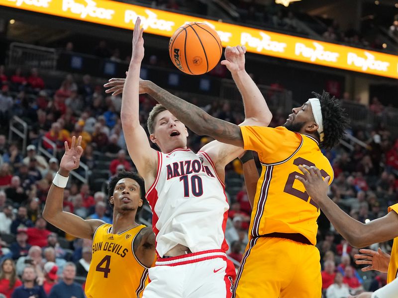 Mar 10, 2023; Las Vegas, NV, USA; Arizona Wildcats forward Azuolas Tubelis (10) looks for a rebound between Arizona State Sun Devils guard Desmond Cambridge Jr. (4) and Arizona State Sun Devils forward Warren Washington (22) during the second half at T-Mobile Arena. Mandatory Credit: Stephen R. Sylvanie-USA TODAY Sports