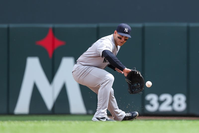 May 16, 2024; Minneapolis, Minnesota, USA; New York Yankees first baseman Anthony Rizzo (48) fields the ball hit by Minnesota Twins Max Kepler (26) during the ninth inning at Target Field. Mandatory Credit: Matt Krohn-USA TODAY Sports