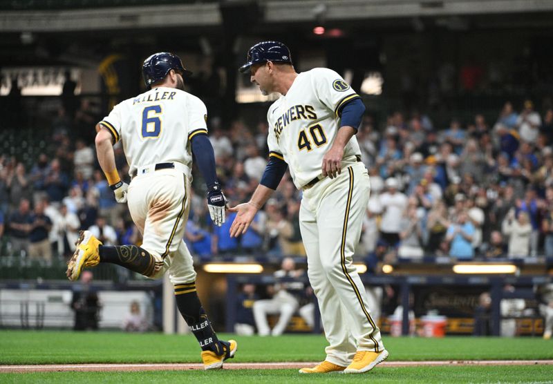 May 23, 2023; Milwaukee, Wisconsin, USA; Milwaukee Brewers second baseman Owen Miller (6) is congratulated by Milwaukee Brewers third base coach Jason Lane (40) after hitting a home run against the Houston Astros in the eighth inning at American Family Field. Mandatory Credit: Michael McLoone-USA TODAY Sports