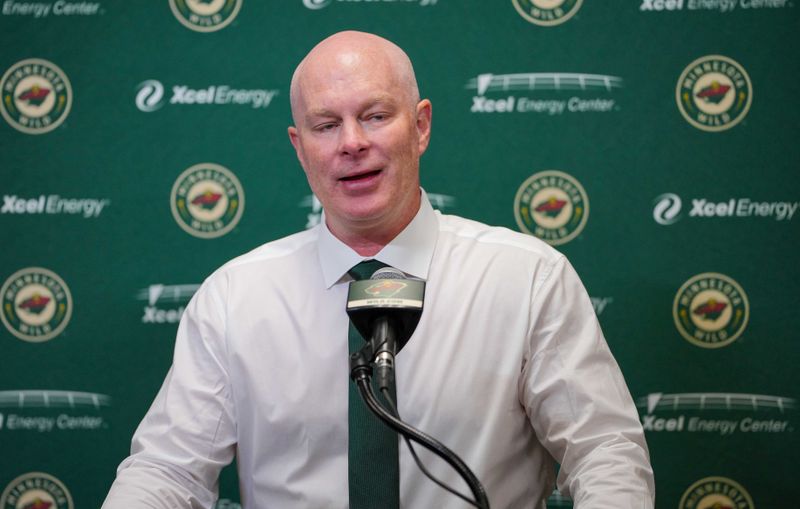 Nov 28, 2023; Saint Paul, Minnesota, USA;  Minnesota Wild head coach John Hynes talks to the media after a game against the St. Louis Blues at Xcel Energy Center. Mandatory Credit: Brad Rempel-USA TODAY Sports