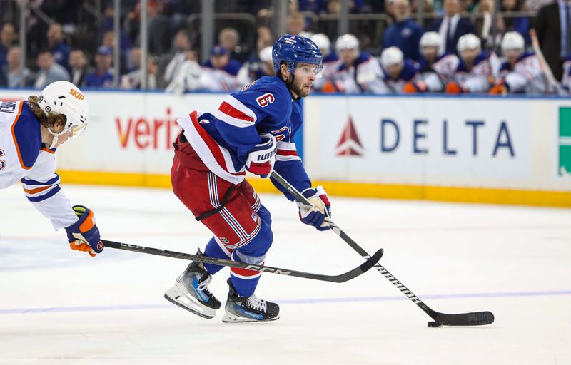 Mar 16, 2025; New York, New York, USA; New York Rangers defenseman Zac Jones (6) looks to shoot against the Edmonton Oilers during the second period at Madison Square Garden. Mandatory Credit: Danny Wild-Imagn Images